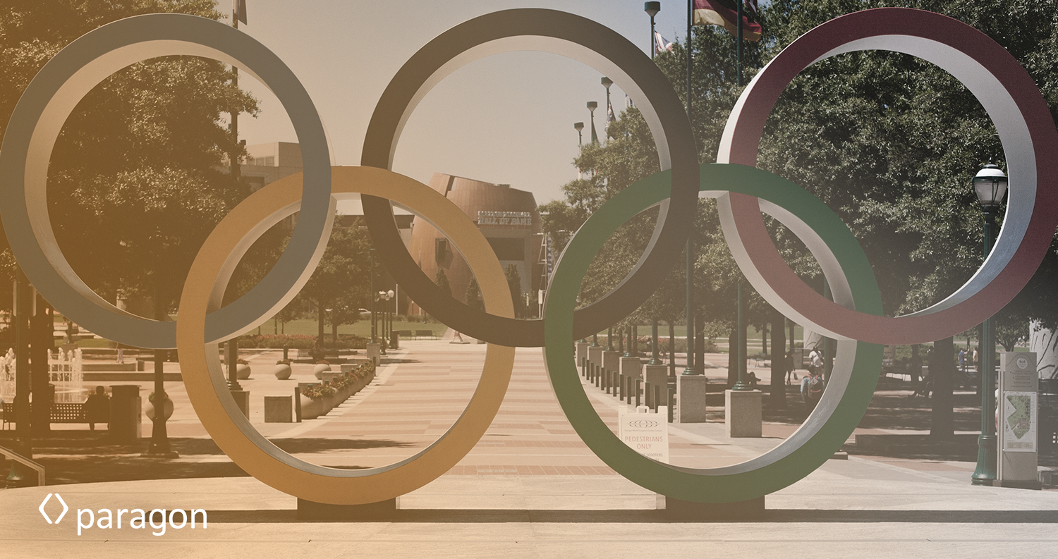Olympic rings at the entrance to an athletic center.